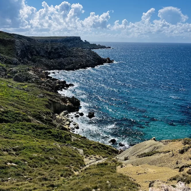 A scenic view of the coastline in Majjistral Park that showcases the rugged terrain, clay cliffs and the Mediterranean Sea.