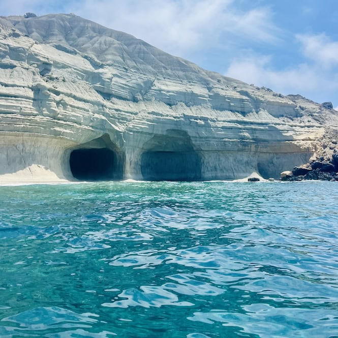 The entrance of the majestic Ta' Marija Cave near Gnejna Beach, with its unique rock formations and crystal clear waters.