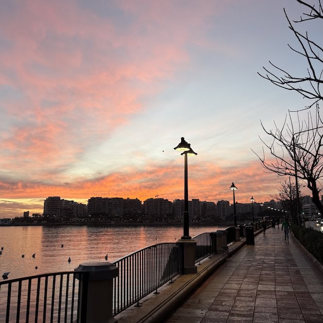Wide pavement along the St Julian’s promenade at sunset, ideal for wheelchair accessible travel Malta